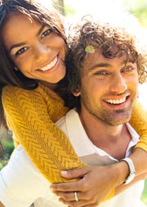 couple smiling with dental implants in Jonesboro