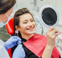 Patient admiring their new dental implant sin Jonesboro