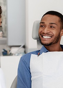 a patient and his dentist chatting