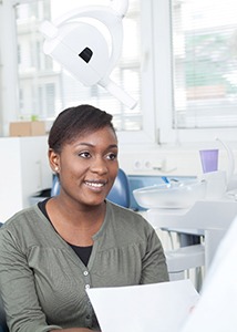 Patient listening to an implant dentist in Jonesboro