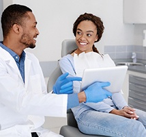 Implant dentist in Jonesboro explaining treatment to a patient