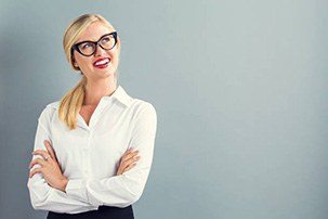 professional woman looking up with arms crossed