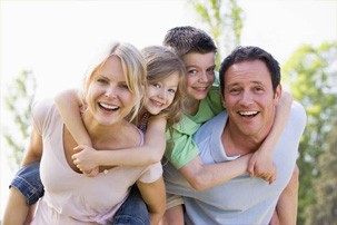 Smiling family outdoors