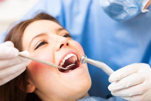 Woman receiving dental treatment