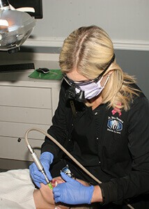 Dentist working on a patients teeth