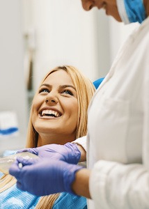 Male dentist working on patients mouth