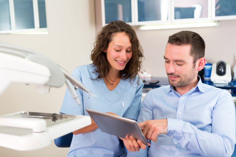 patient talking to their dentist