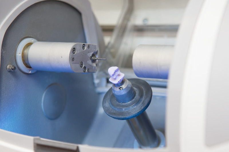 A CEREC milling machine making a dental crown